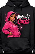 Black hoodie with a graphic of a woman in a pink hoodie and 'Nobody Cares' text.